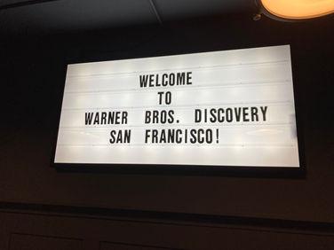 A photo of a backlit sign that reads "WELCOME TO WARNER BROS. DISCOVERY SAN FRANCISCO!" in rearrangable letters.